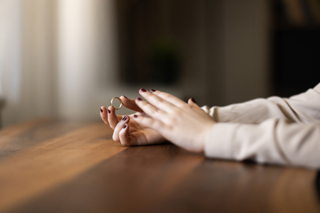 Woman wearing her wedding ring after withdrawing divorce